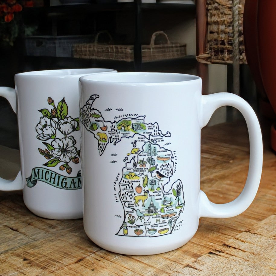 White ceramic mug with an illustrated map of Michigan