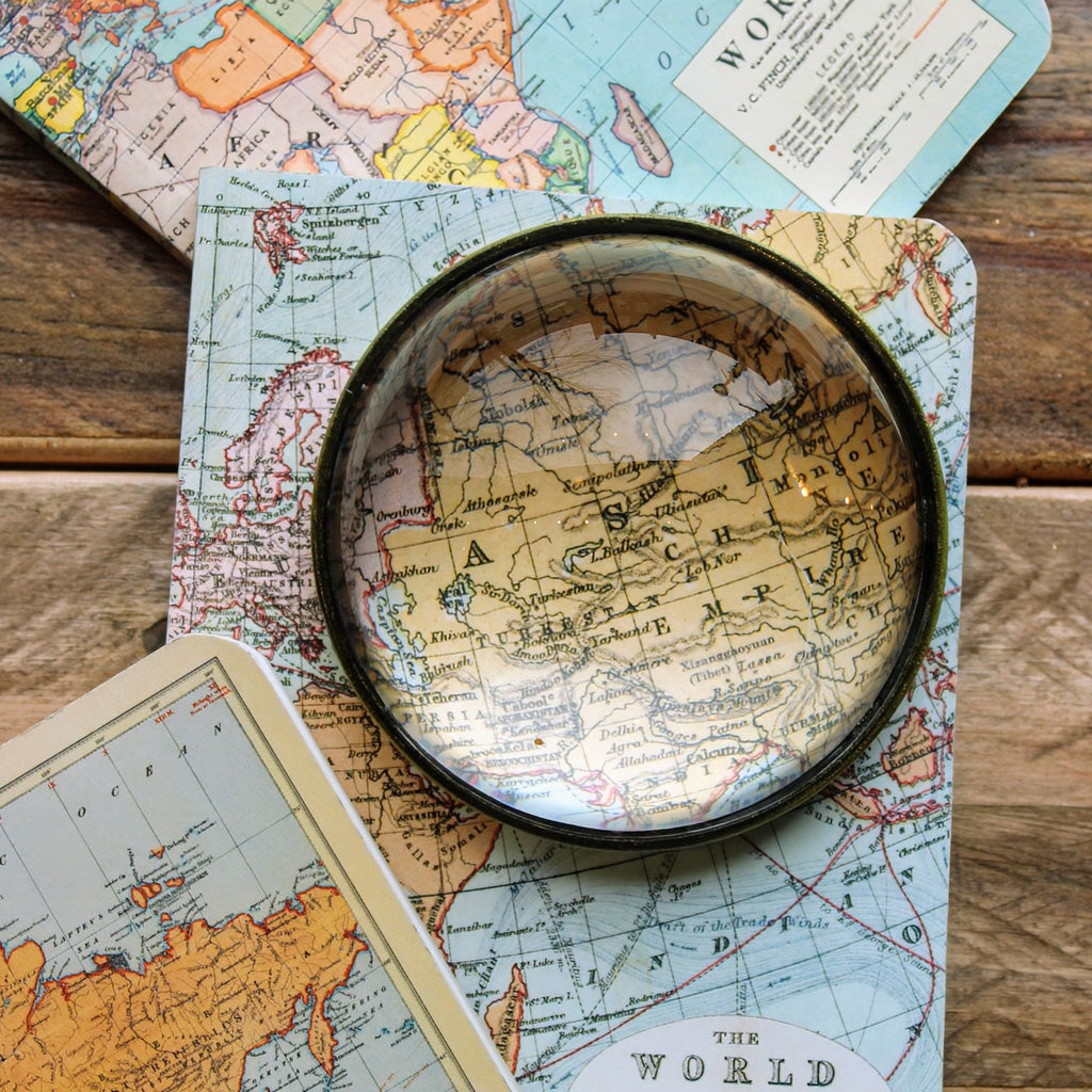 World Maps Mini Notebook Set featuring three vintage-style map covers, including historical country borders. With a magnifying glass on top.