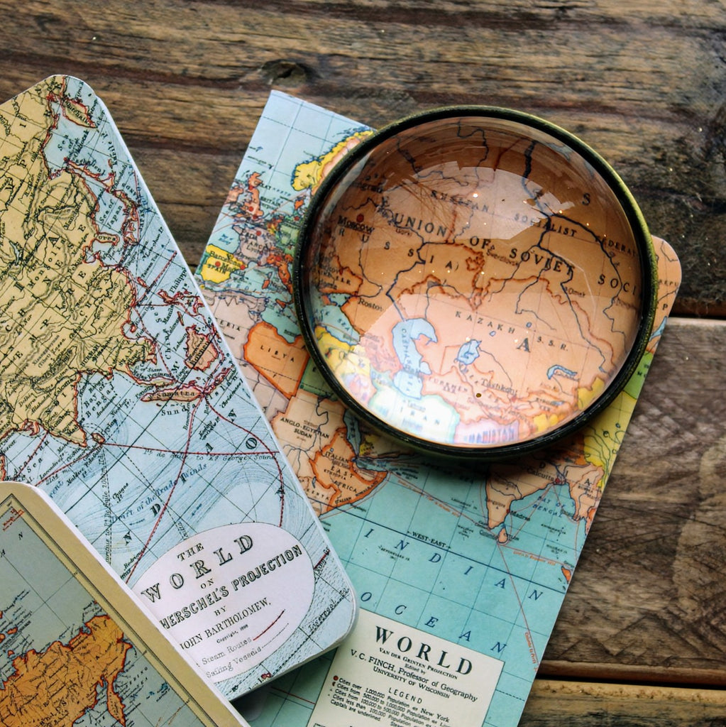 World Maps Mini Notebook Set featuring three vintage-style map covers, including historical country borders. With a magnifying glass highlighting the USSR.