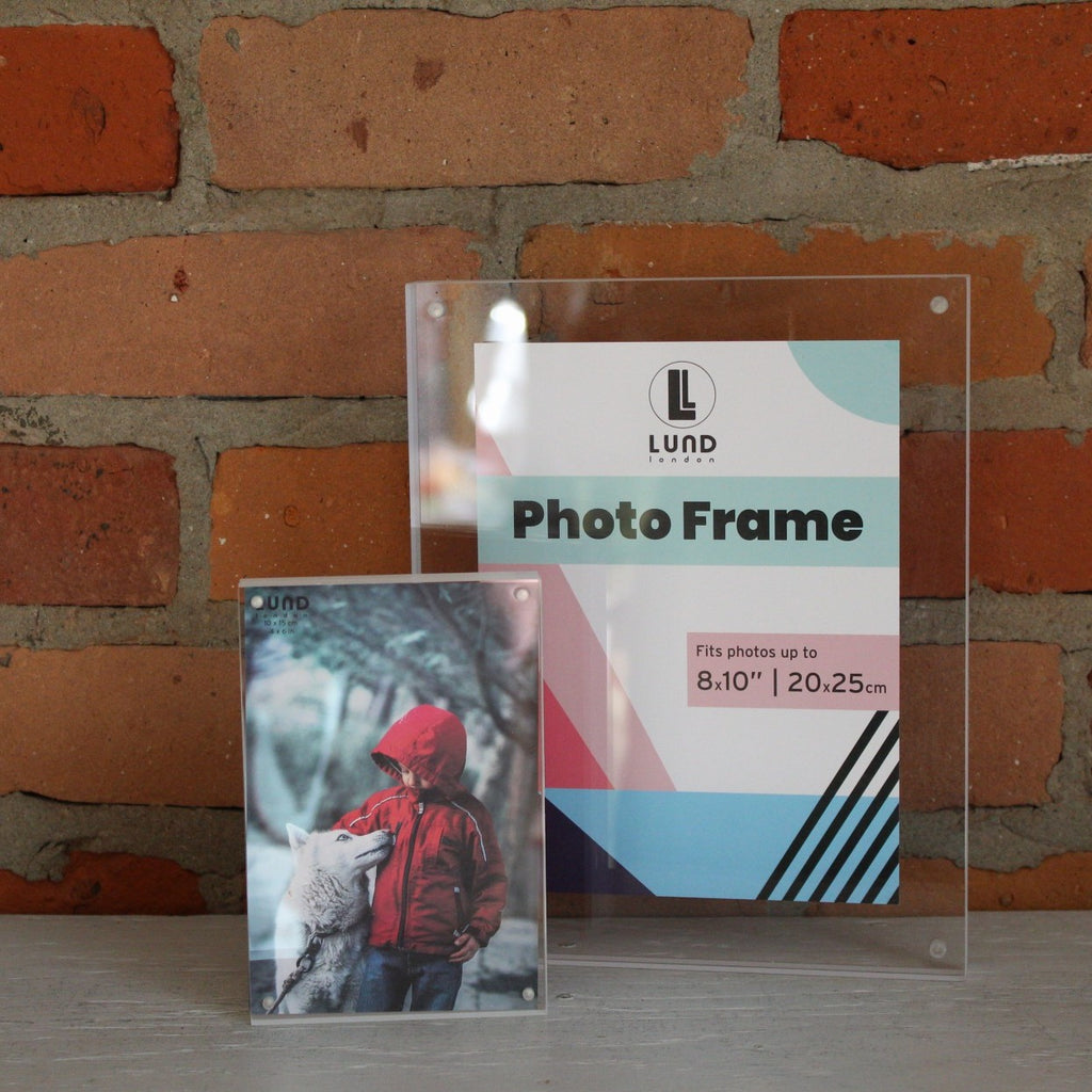 Two acrylic photo frames 4x6 and 8x10 with a white edge