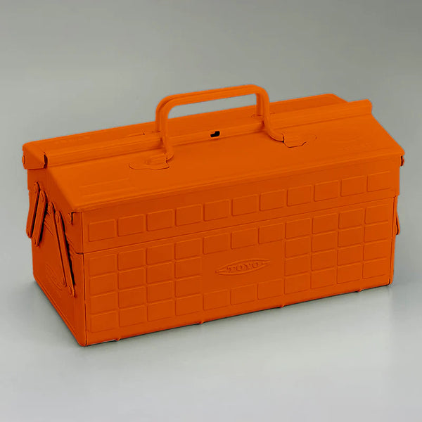 Orange toolbox with a handle on a gray background