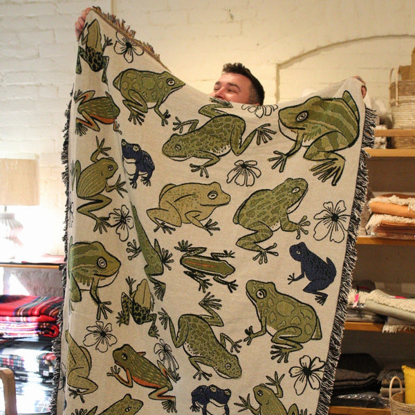 Fringed throw blanket with colorful assorted frogs